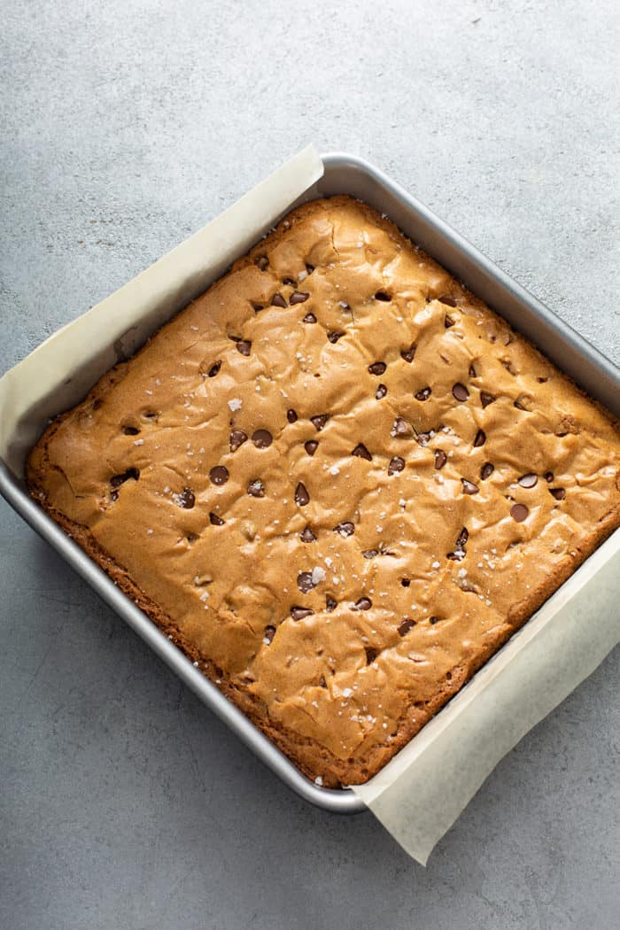 Baked chocolate chip blondies in a metal baking pan