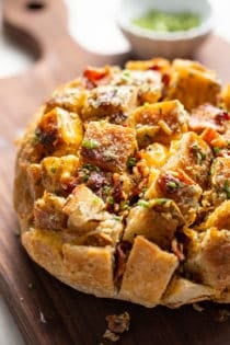 Close up of cheesy ranch pull-apart bread on a cutting board