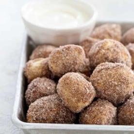 Cinnamon Sugar Soft Pretzel Bites are super simple to make. Serve them up with a side of cream cheese icing for the ultimate game day snack! So fun!