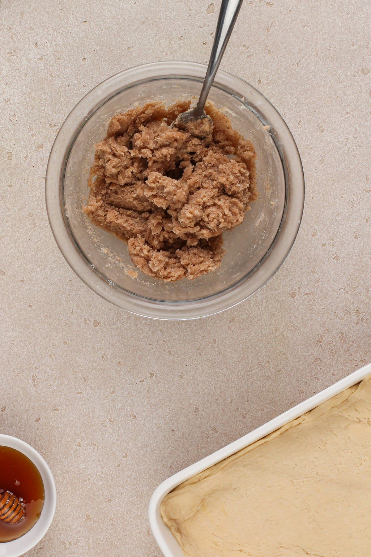 Cinnamon-sugar topping for sopapilla cheesecake in a glass mixing bowl.