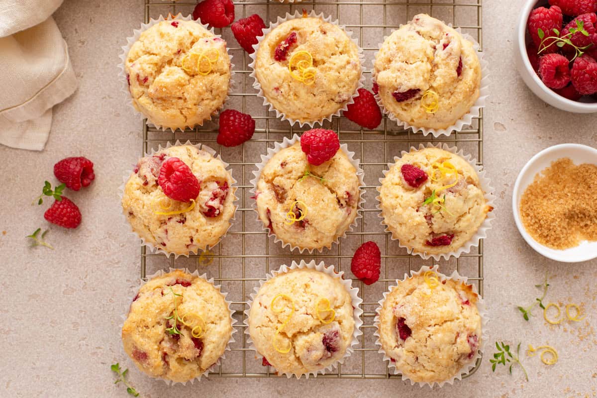 Overhead view of lemon raspberry muffins cooling on a wire rack.