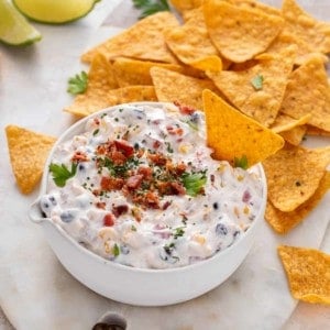 Fiesta ranch dip surrounded by tortilla chips.