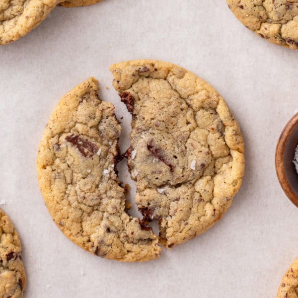 Halved easy chocolate chip cookie on a countertop.