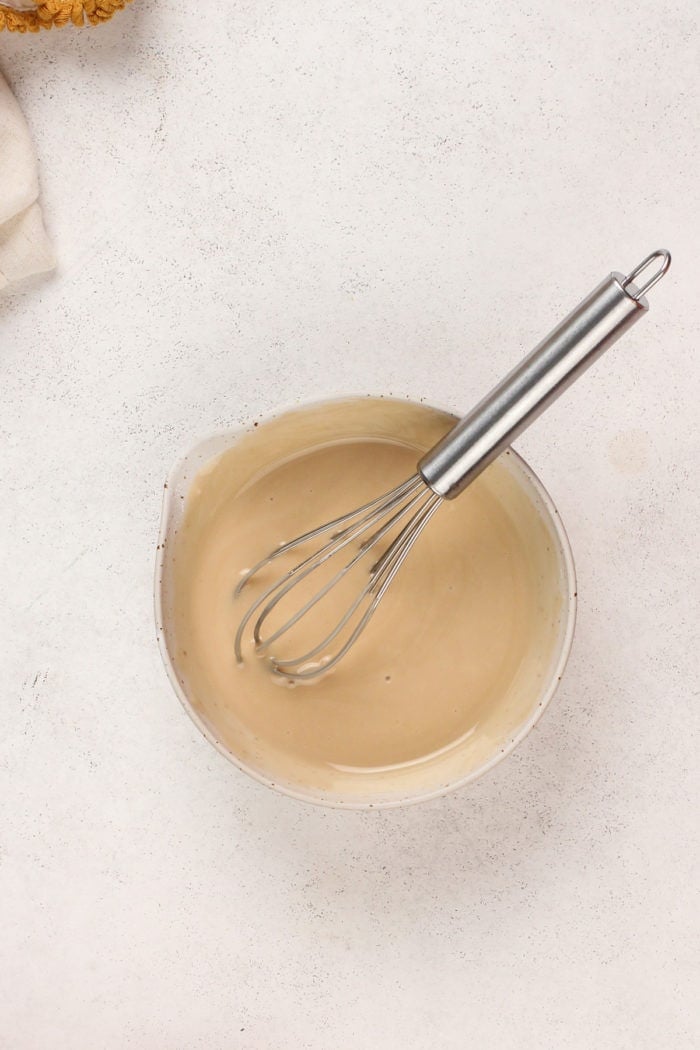 Maple glaze in a small white bowl.