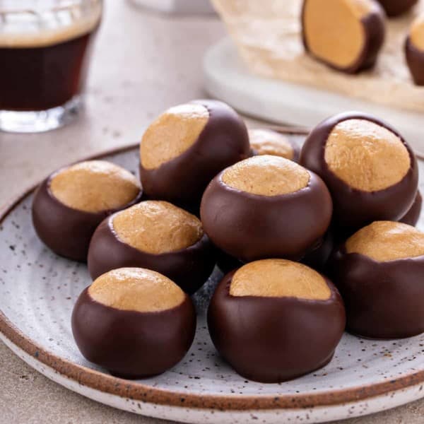 Pottery plate filled with buckeye candies.