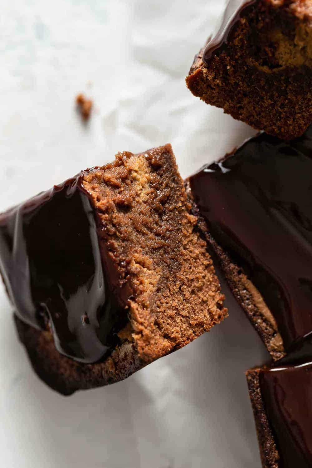 Close up of pumpkin brownie turned on its side to show the pumpkin swirl layer