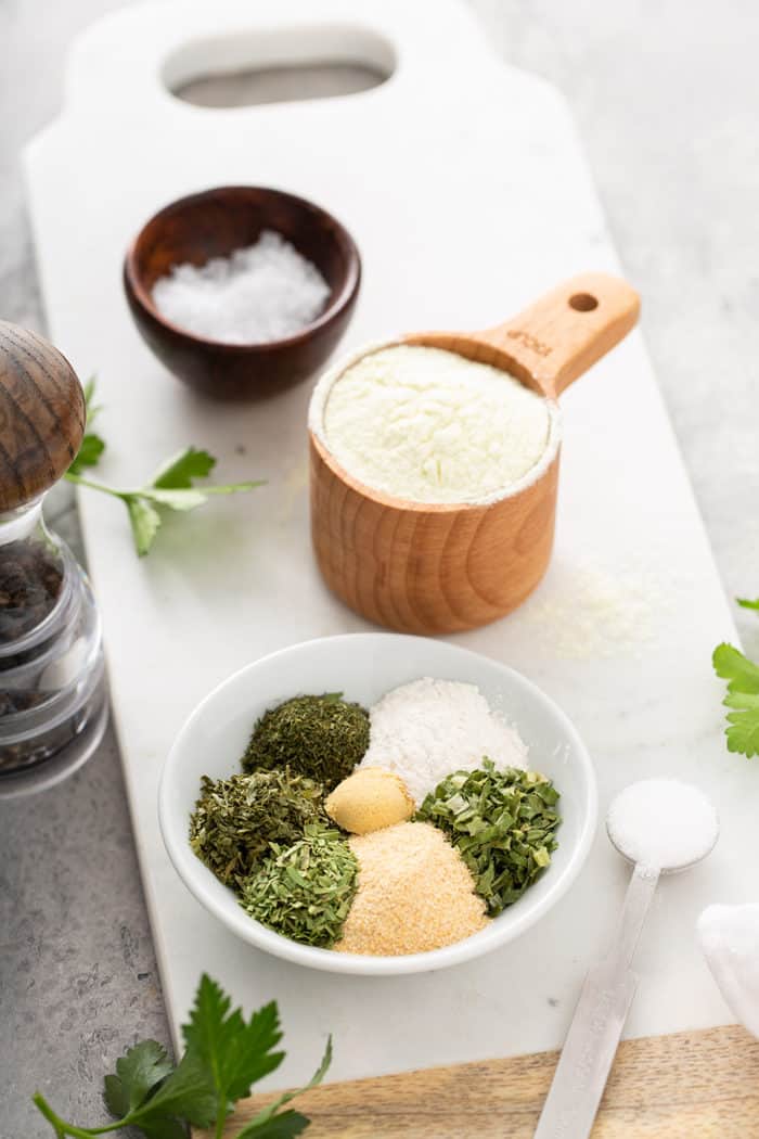 Ingredients for ranch seasoning mix arranged on a cutting board