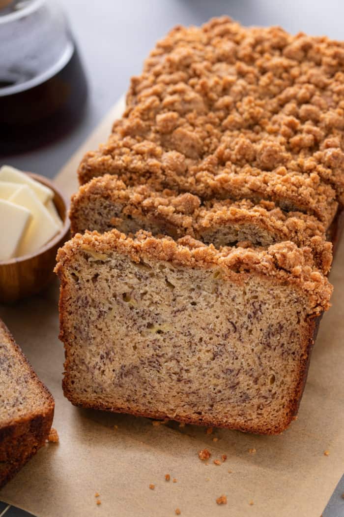 Loaf of brown butter banana bread cut into slices.