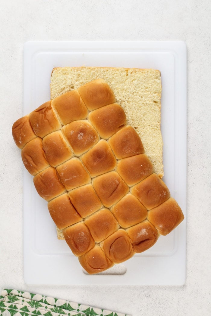 Hawaiian rolls sliced horizontally.