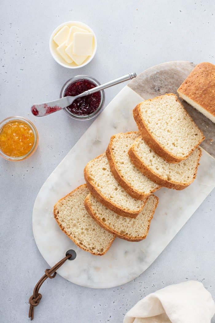 Slices of english muffin bread arranged on a marble board