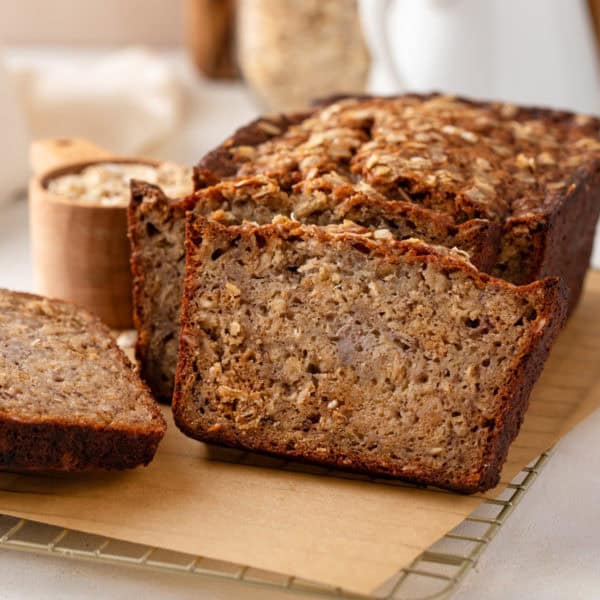 Sliced loaf of oatmeal banana bread.