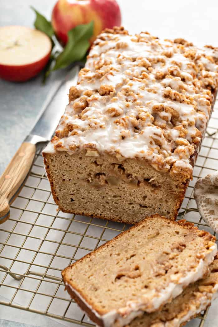 Sliced apple fritter bread set on a wire cooling rack