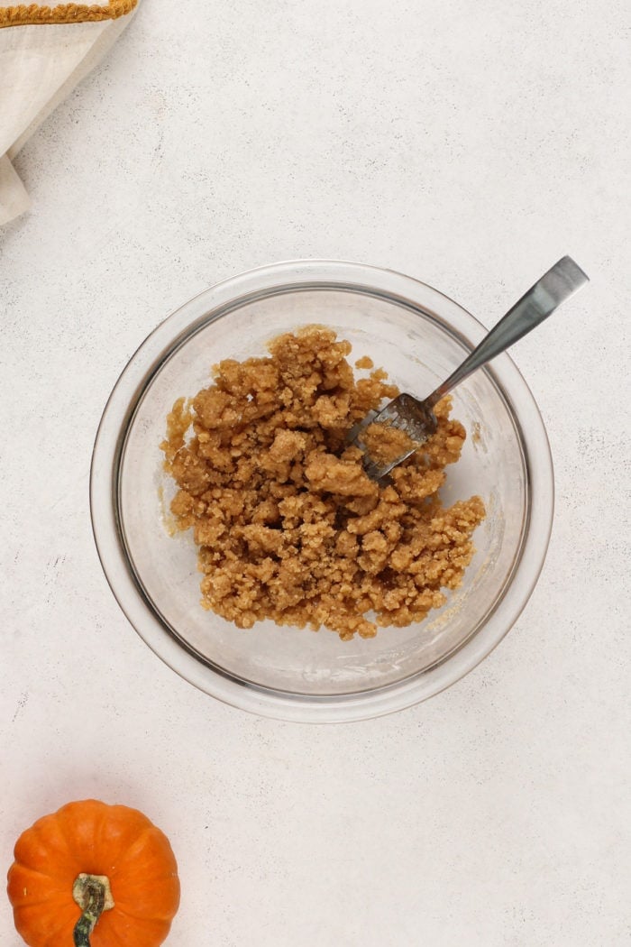 Streusel topping for pumpkin bread in a glass mixing bowl.