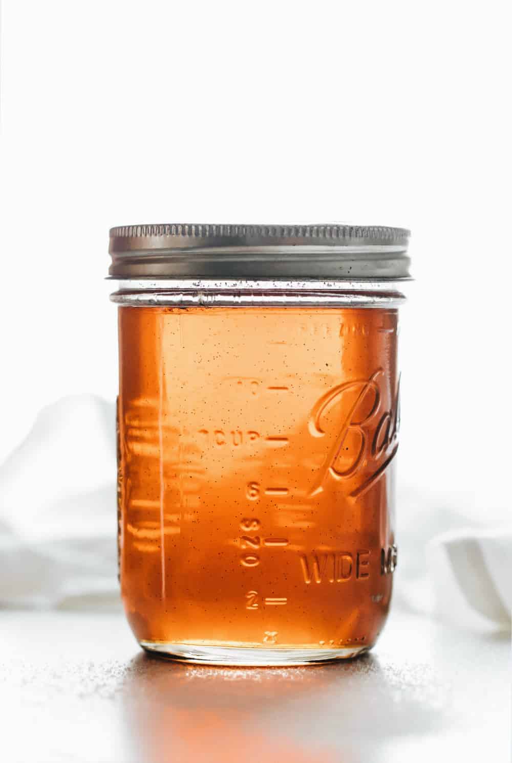 Vanilla coffee syrup in a glass mason jar